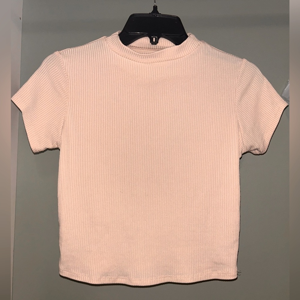 Brand is Santory and in size small and color is a lightish pink cream